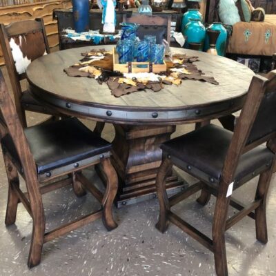 This 60 Inch Table Is Held By A Pedestal Base And Is Accompanied By 4 Cowhide & Leather Chairs.