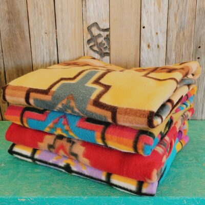 Fleece Baja Stack Displaying Different Colors And Styles.