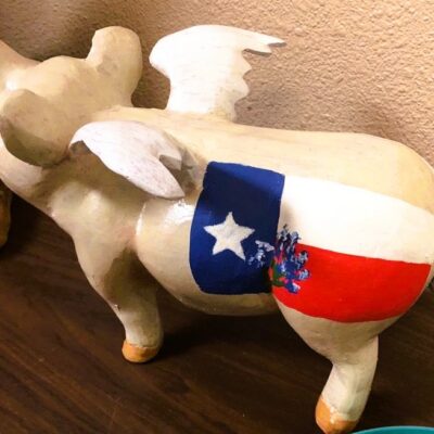 "When Pigs Fly" Has Arrived! This Piece Is Custom Painted With A Texas Flag & Bluebonnet But Can Also Be Ordered As A Life-like Piglet.