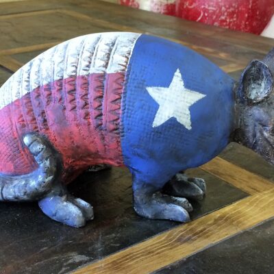 Aluminum Armadillo With Texas Flag For Sale At Rustler's Junction In Lampasas.