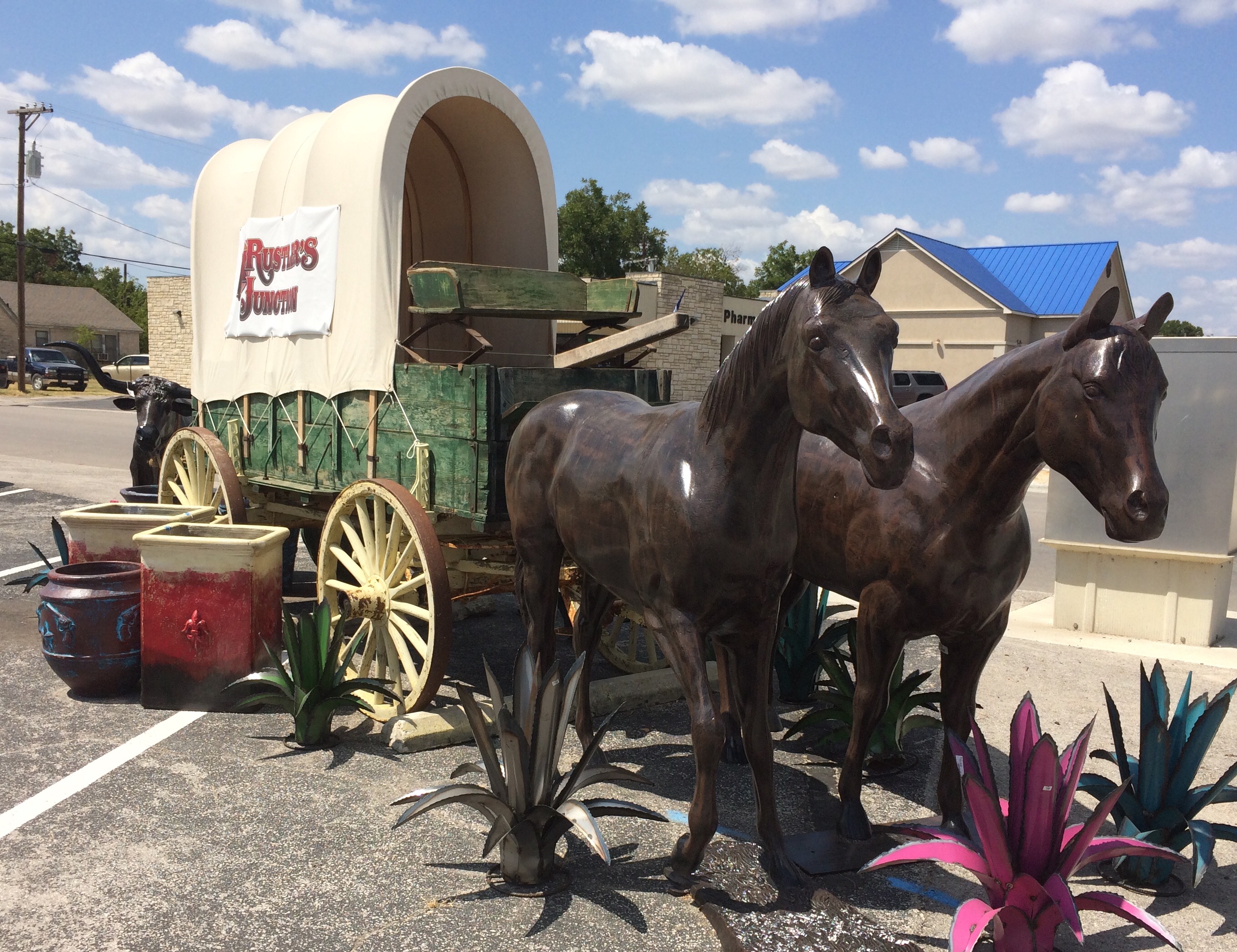 horse statues pulling wagon at Rustler's Junction in Lampasas, TX