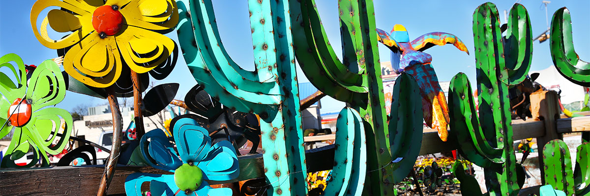 colorful steel art flowers and cactus at Rustler's Junction
